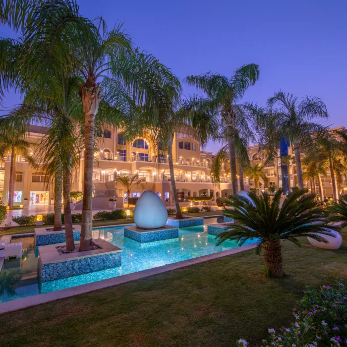 Premier Le Rêve Hotel & Spa pool and palms